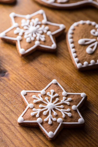 Christmas sweet cakes. Christmas homemade gingerbread cookies on wooden table
