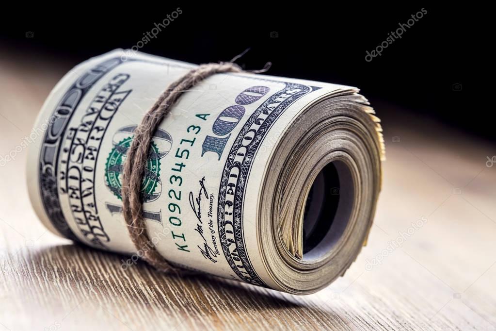 Dollar currency.Dollar banknotes rolled in other positions