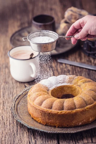 Marble cake.Easter Cake. Marble cake cup of coffee powder sugar and kitchen vintage utensil — Stock Photo, Image