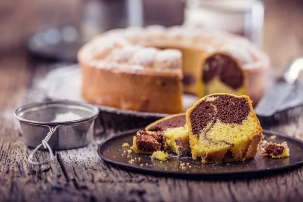 Marble cake.Easter Cake. Marble cake cup of coffee powder sugar and kitchen vintage utensil — Stock Photo, Image