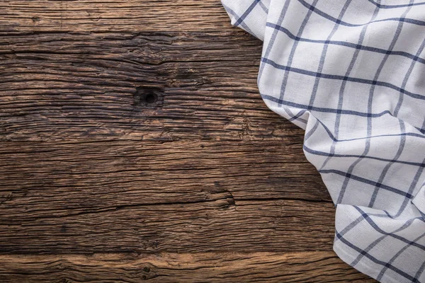 Widok z góry obrus w kratkę lub serwetka na pusty Stół drewniany — Zdjęcie stockowe