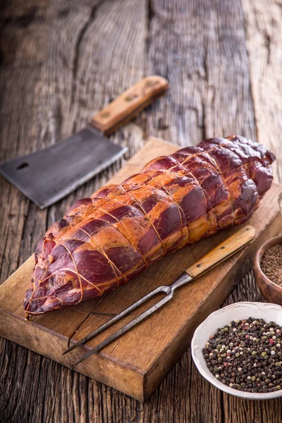 Pork meat.Pork chop smoked. Traditional smoked meat on oak wooden table in other positions