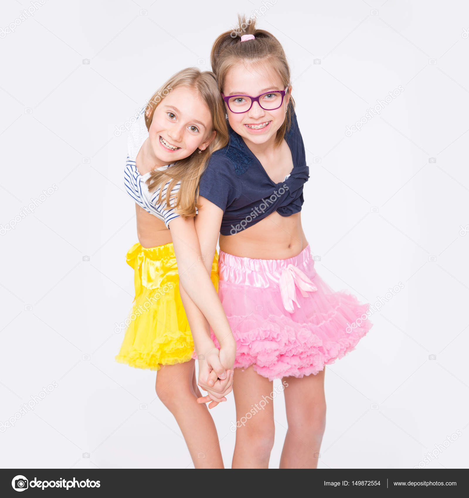 Playful Young Naughty Sisters Having Fun Stock Photo Playful Young Naughty Sisters Having Fun Stock Photo