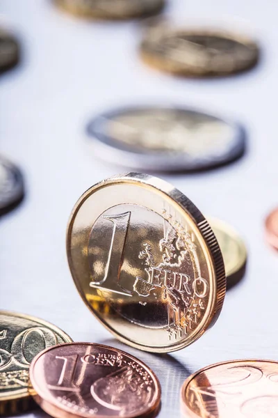 One euro coin on the edge. Euro money currency. Euro coins stacked on each other in different positions — Stock Photo, Image