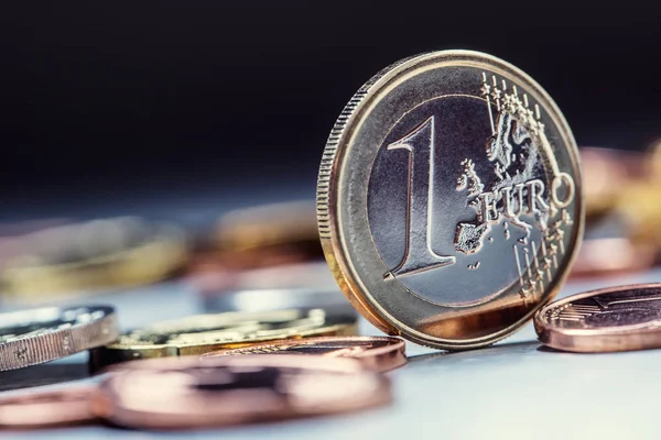 One euro coin on the edge. Euro money currency. Euro coins stacked on each other in different positions — Stock Photo, Image