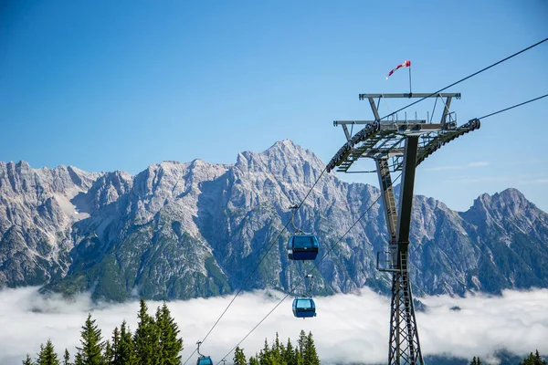 Ski lift or cable way summer season morning fog in the Austrian Alps - Salzburg, Leogang — Stock Photo, Image