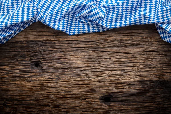 Oktoberfest. The blue checkered tablecloth or napkin typical of the Munich Beer Festival in the German Oktoberfest. Free space for your text product or information — Stock Photo, Image