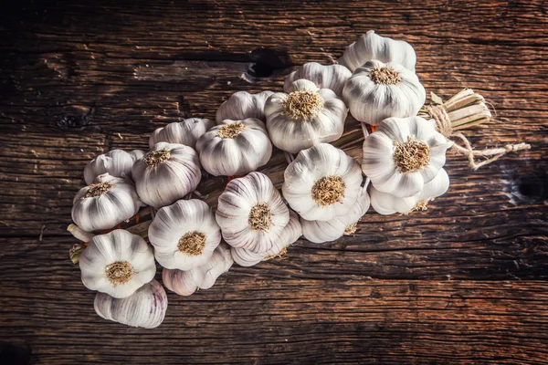 Garlic. Garlic bulbs. Fresh garlic on rustic oak table