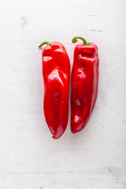 Top of view  fresh red pepper on white concrete background