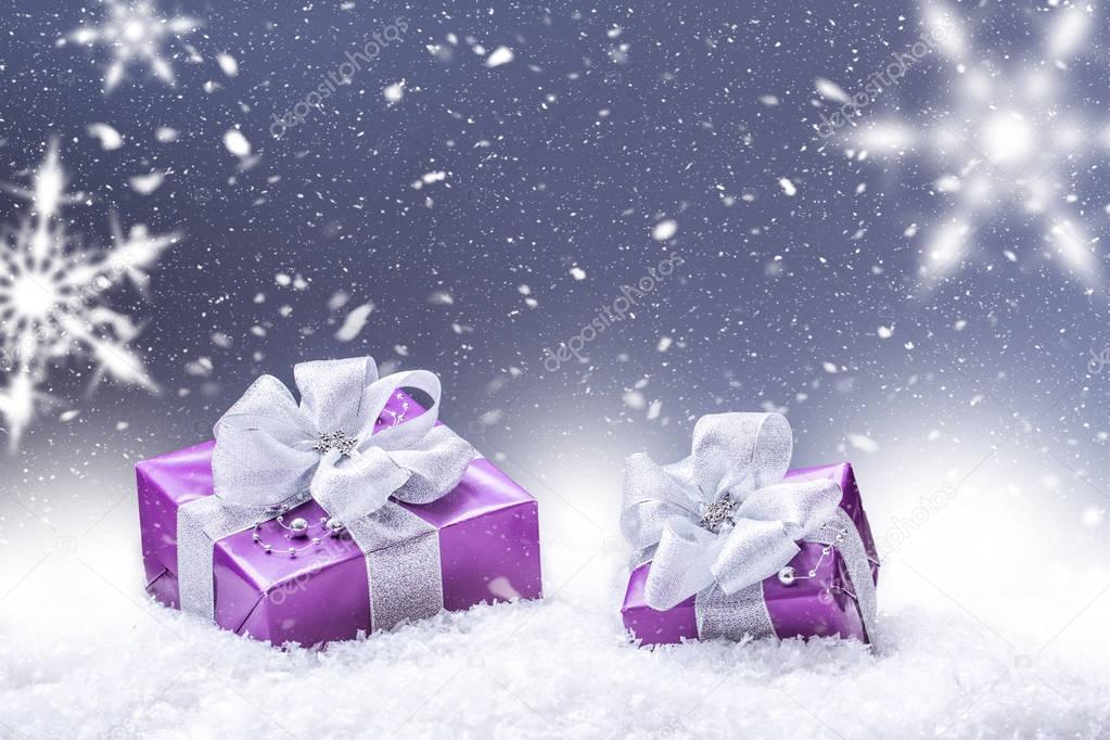Purple christmas gift snow and abstract snowy background