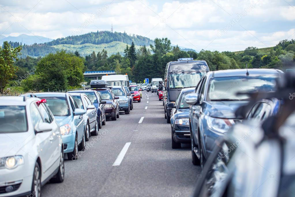 Traffic jam on the highway in the summer holiday period or in a traffic accident. Slow or bad traffic.