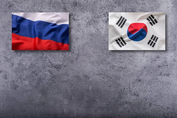 Bandiere della Russia e della Corea del Sud. Russia e Corea del Sud bandiera su co — Foto Stock
