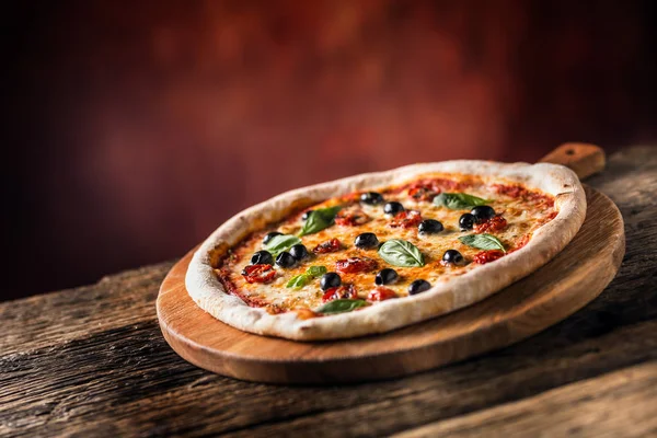 Pizza. Tasty fresh italian pizza served on old wooden table — Stock Photo, Image