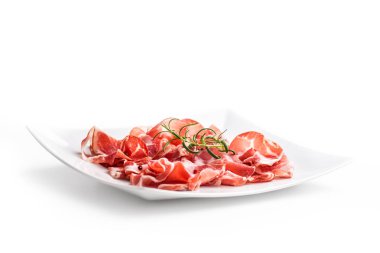 Prosciutto. Rosemary ile lezzetli İtalyan prosciutto kıvrılmış dilim