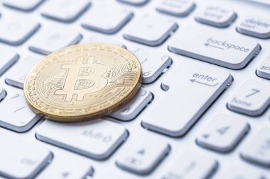 Bitcoins. Dizüstü bilgisayar, para birimi, kripto para birimi işareti Bitcoin sembolü