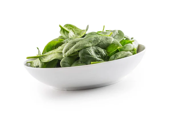 Spinach. Fresh baby spinach leaves in plate isolated on white — Stock Photo, Image