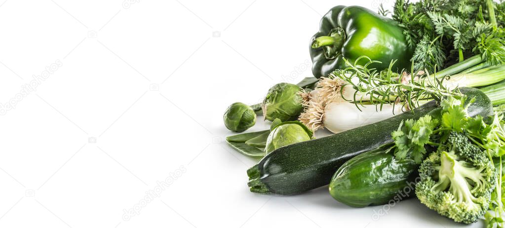 Green fresh vegetable isolated on white background. Onion cucumber peas broccoli zucchini and other healthy vegetables