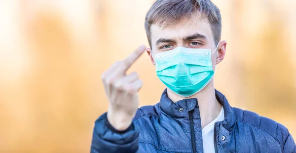 Young Man Protective Mask Shows Obscene Gesture Fucker Coronavirus Covid — Stok fotoğraf