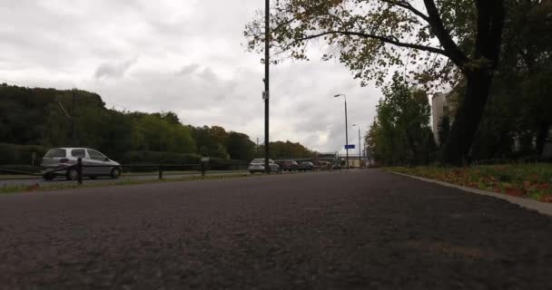 Camera Lies On A Road. yclist Going Past To The Camera — Stock Video