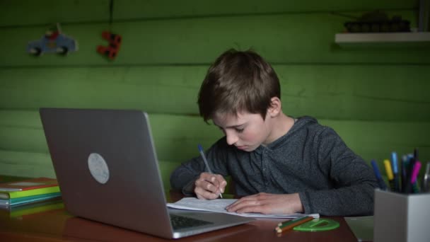 A Schoolboy Studies at Home Remotely via Video Communication. Online Education — Stock Video