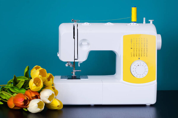 Sewing machine on table in workshop.