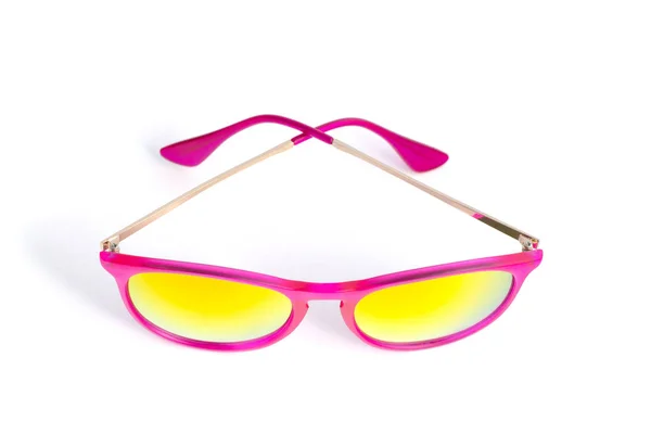 Eine rosa Sonnenbrille auf weißem Hintergrund. der Blick von oben — Stockfoto