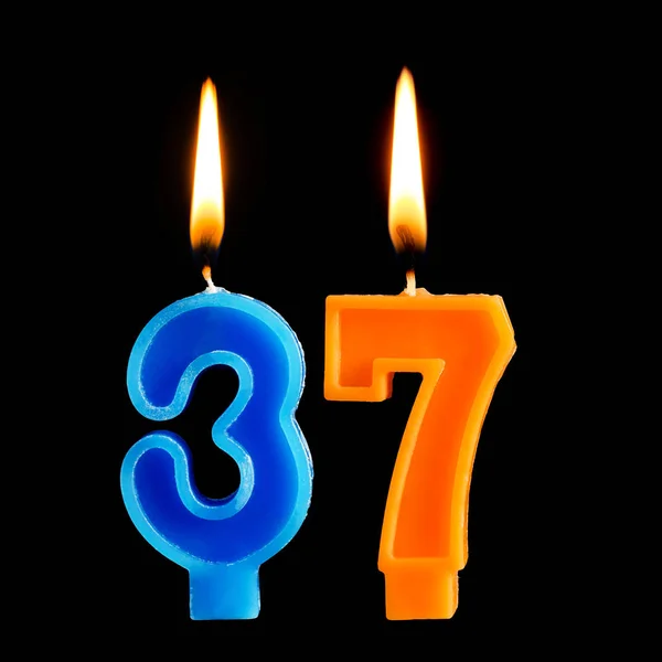 Burning birthday candles in the form of 36 thirty six for cake isolated on black background. — Stock Photo, Image