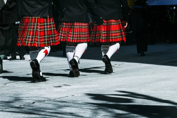 Marching Scottish Kilts synchronized