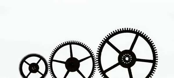 Three Silhouettes Gears Different Sizes White Background — Stock Photo, Image