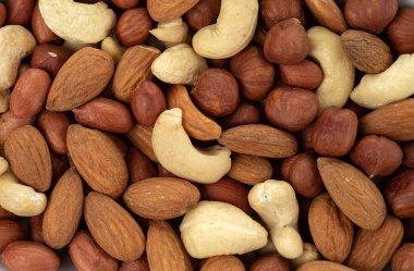 Ceviz, fıstık, fıstık, fındık ve badem karışımından oluşan bir arka plan.. 