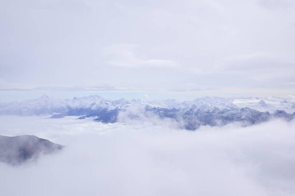 Mont Blanc. Aerial view of the Alps surrounded by clouds.