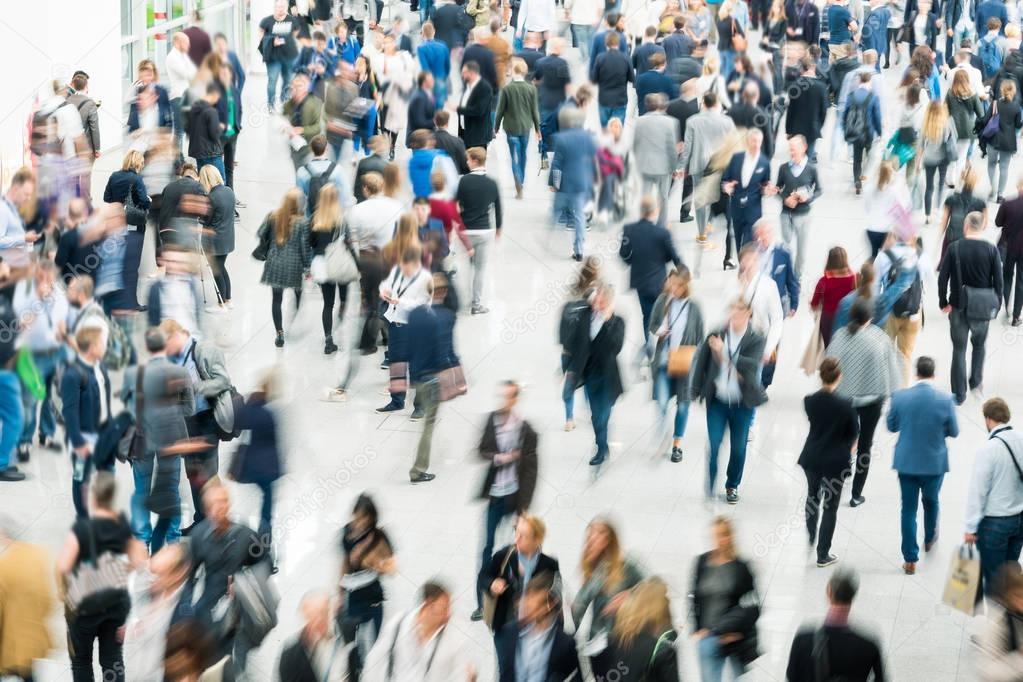 blurred people in a modern hall