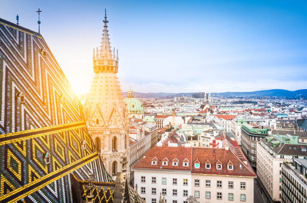 Vienna skyline with famous St. Stephen's Cathedral roof at sunset, Austria