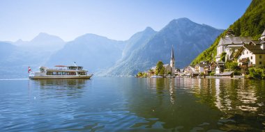 Classic view of Hallstatt with traditional passenger ship in summer, Austria clipart