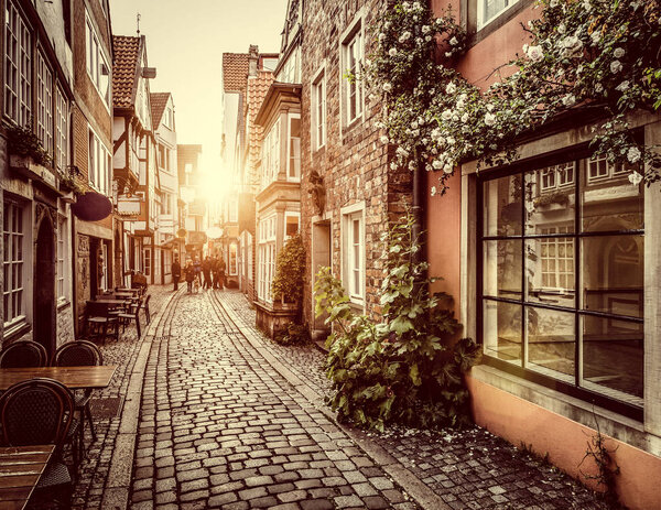 Old town in Europe at sunset with retro vintage filter effect