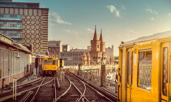 Berlin Oberbaum Bridge with trains at sunset, Berlin Friedrichshain Kreuzberg, Germany
