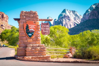 Zion National Park entrance monument sign on a beautiful sunny day with blue sky in summer, Utah, USA clipart