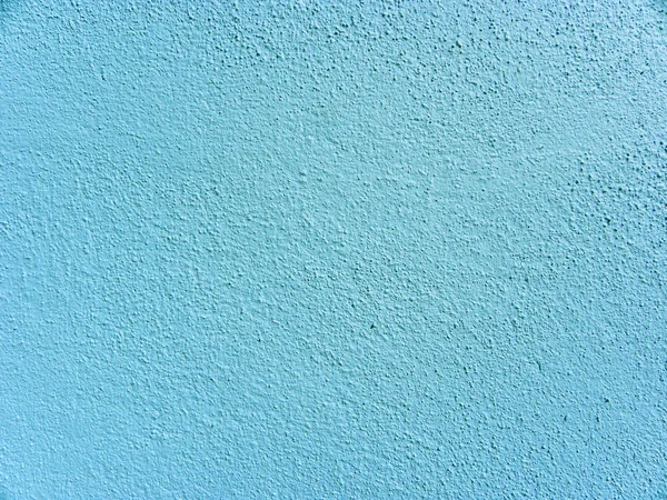 Blue color painted on concrete wall texture background.  Blue color concrete wall background
