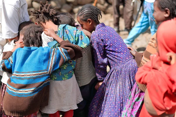 Girls and boys swirl around a tourist. Oromia-Ethiopia. 0522 — Stock Photo, Image