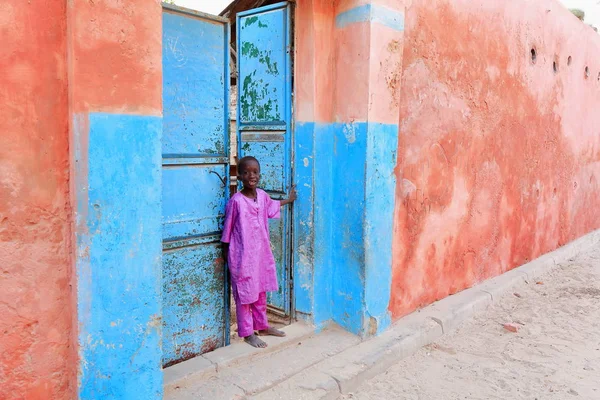Local boy at his home.s gate. Saint-Louis-du-Senegal. 2535 — Stock Photo, Image