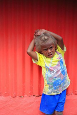 Blond young boy of the ni-Vanuatu people. Panngi-Pentecost island-Vanuatu. 6383 clipart