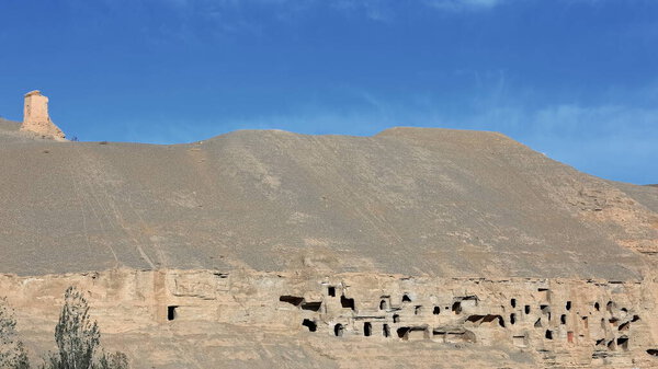 Mogao Buddhist caves cut on a 2 km.long cliff above Dachuan river. 243 of them placed in the North section-living quarters-meditation chambers-burial sites for the monks. Dunhuang-Gansu province-China