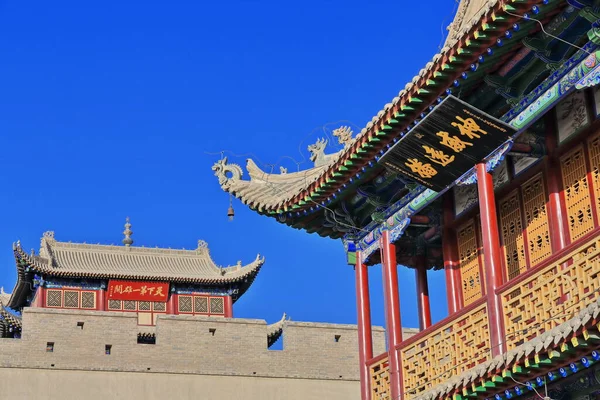 Wenchang Hall-three story E.gate tower on Guanghua Lou-Enlightenment Gate Jiayuguan fort-brick wall with red plaque reading Tian Xia Di Yi Xiong Guan-First and Greatest Pass under Heaven. Gansu-China.