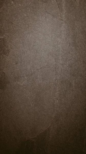 Engebeli taş duvarın yakın plan, arkaplanı grunge desenli.