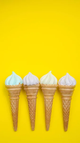 Ice cream cone, summer concept. Ice cream on colored background. Waffle cone with dessert. Side view. Minimal concept