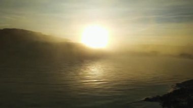 thermal pool at sunrise, The steam rises above the water, Relaxation