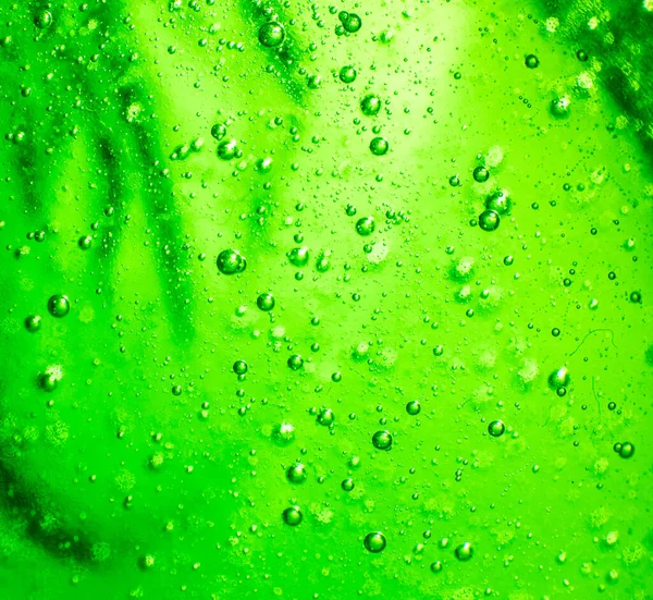 Verschwommener Abstrakter Urlaubshintergrund Luftblasen Einer Grünen Flüssigkeit Hintergrund — Stockfoto