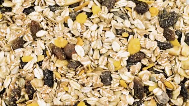 Granola textuur, muesli textuur, sluiten foto afbeelding op granola of muesli stapel presenteren een detail met het oog op granola of muesli textuur, een granen graan gezond voedsel, kan gebruiken voor de achtergrond — Stockvideo