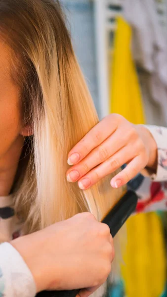 Blond Woman Bathroom Straightens Her Hair Curling Iron — Stock Photo, Image