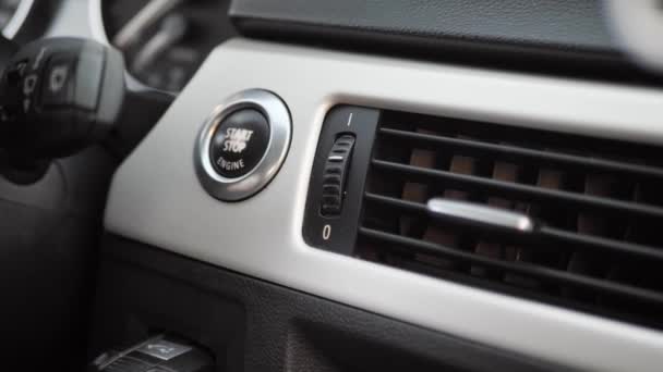 Man presses shabby start button in car, close up — Stock Video